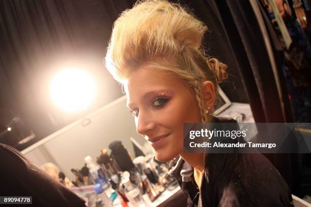 Model is seen backstage before the Ed Hardy fashion show during Mercedes Benz Fashion Week Swim at Cabana Grande on July 18, 2009 in Miami, Florida.