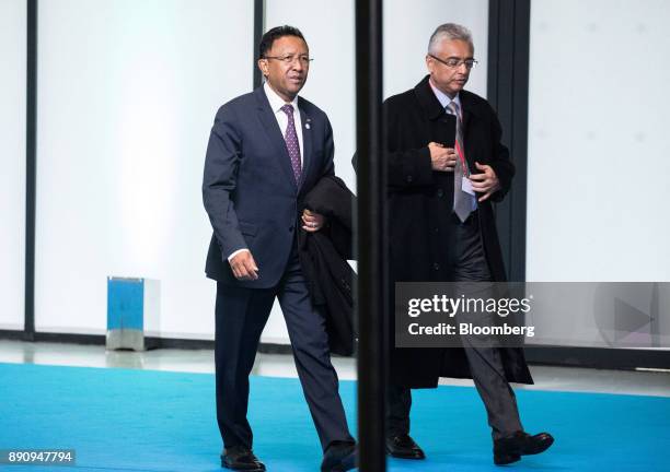 Hery Rajaonarimampianina, Madagascar's president, left, arrives at the One Planet Summit in Paris, France, on Tuesday, Dec. 12, 2017. French...