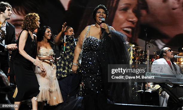 Josh Groban, Susan Sarandon, Lil' Kim, Aretha Franklin and Stevie Wonder perform during the Mandela Day: A 46664 Celebration Concert at Radio City...