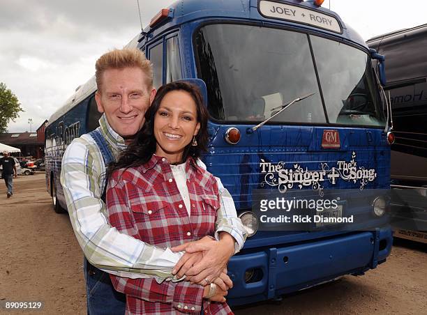 Joey Martin Feek and Rory Lee Feek of singer/Songwriter duo Joey + Rory pose by their 1955 tour bus backstage at the 17th Annual Country Thunder USA...