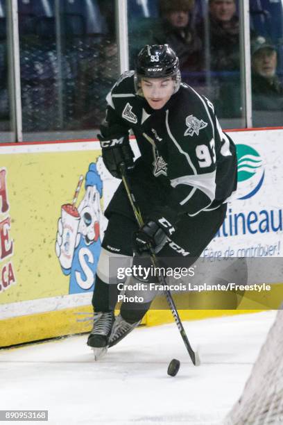 Jeffrey Durocher of the Gatineau Olympiques skates with the puck against the Saint John Sea Dogs on December 1, 2017 at Robert Guertin Arena in...