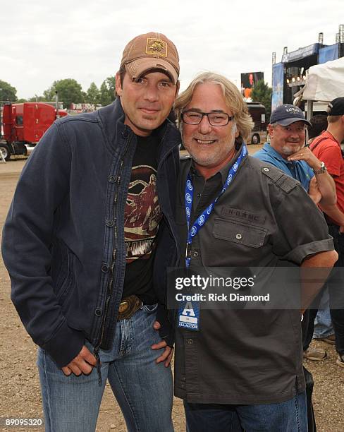 Singer/Songwriter Rodney Atkins and CAA's Rod Essig pose backstage at the 17th Annual Country Thunder USA music festival on July 18, 2009 in Twin...