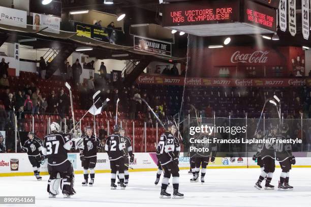 Members of the Gatineau Olympiques salute their fans at center ice after their win against the Saint John Sea Dogs on December 1, 2017 at Robert...