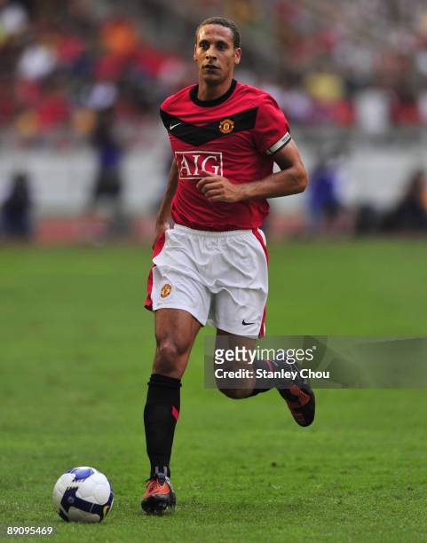 Rio Ferdinand of Manchester United runs with the ball during the pre-season friendly match between Manchester United and Malaysia XI at the Bukit...