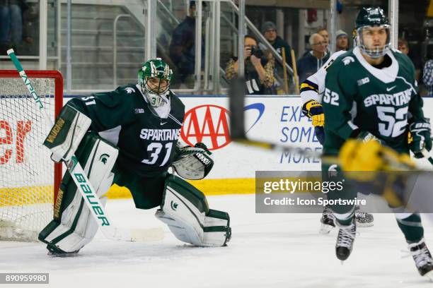 Michigan State Spartans goalie John Lethemon guards the net during a regular season Big 10 Conference hockey game between the Michigan State Spartans...