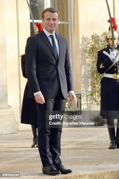 French President Emmanuel Macron reacts as he receives international leaders for a meeting for the One Planet Summit's international leaders at...