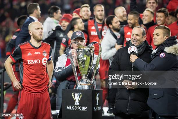 Don Garber, Commissioner of Major League Soccer presents the MLS Championship Cup to Michael Bradley of Toronto FC and Larry Tanenbaum Chairman of...