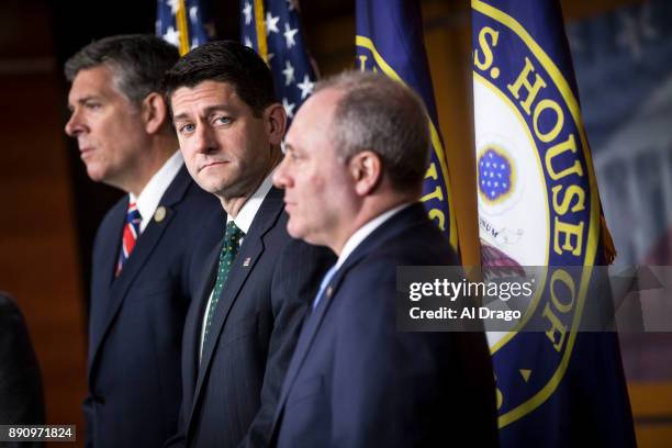 Speaker of the House Paul Ryan listens beside Rep. Darin LaHood , left, and House Majority Whip Steve Scalise during a news conference on Capitol...