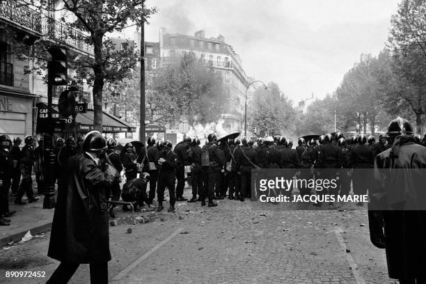 Police confront the students and walk under cobblestones on the boulevard Saint Germain on May 6 1968, during the May-June 1968 events in France....