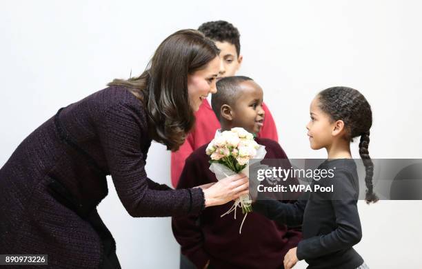 Catherine, Duchess of Cambridge speaks to Yahya Hussein Ali and Dawud Wahabi children affected by the Grenfell Tower fire, and Ailise Taylor at its...