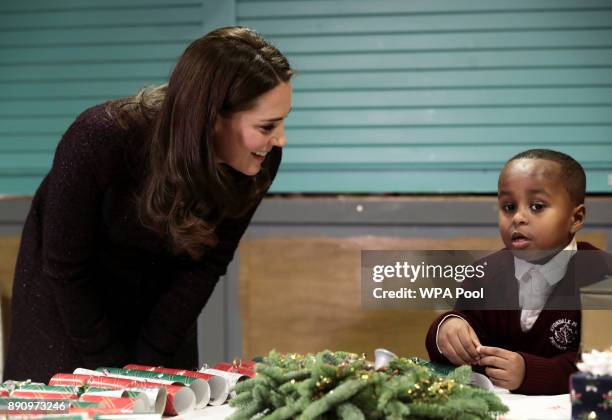 Catherine, Duchess of Cambridge speaks to Yahya Hussein Ali who was affected by the Grenfell Tower fire, at its community centre in North Kensington...