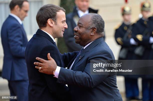 French President Emmanuel Macron welcomes President of Gabon Ali Bongo Ondimba as he arrives for a meeting for the One Planet Summit's international...