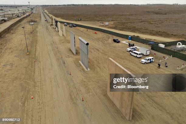 Prototype U.S.-Mexico border walls stand in this aerial photograph taken over San Diego, California, U.S., on Monday, Oct. 30, 2017. President Donald...