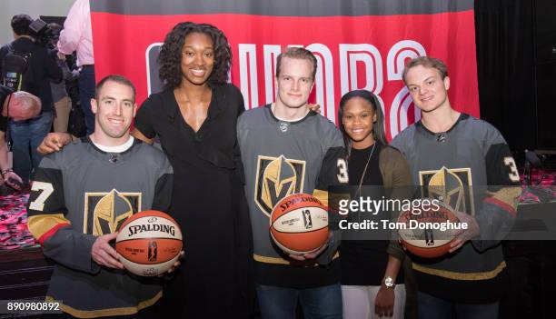 The Golden Knights, Brad Hunt, Oscar Dansk and Reid Duke pose for a photo with Moriah Jefferson and Kayla Alexander during the WNBA announcement of...