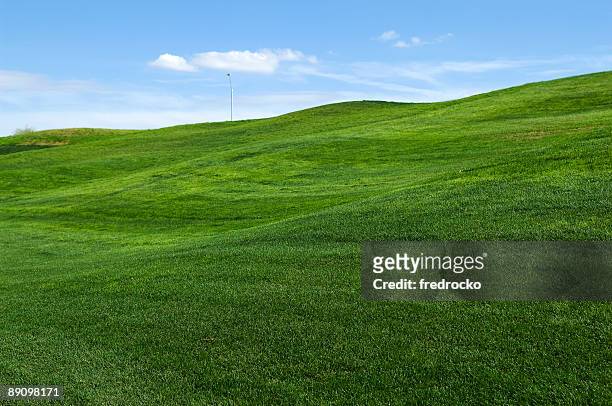 rolling hills of green grass on lawn - hill stock pictures, royalty-free photos & images