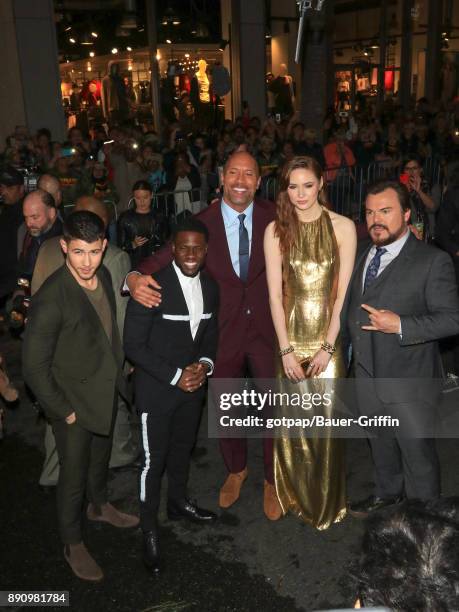 Nick Jonas, Kevin Hart, Dwayne Johnson, Karen Gillan and Jack Black are seen attending the premiere of Columbia Pictures' 'Jumanji: Welcome To The...