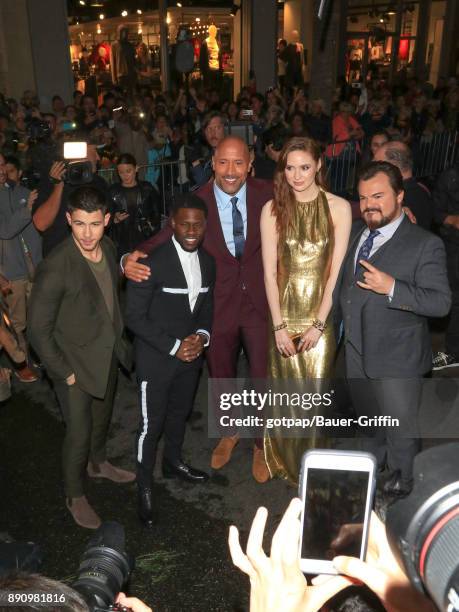 Nick Jonas, Kevin Hart, Dwayne Johnson, Karen Gillan and Jack Black are seen attending the premiere of Columbia Pictures' 'Jumanji: Welcome To The...