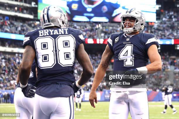 Dak Prescott of the Dallas Cowboys celebrates a touchdown with Dez Bryant in the fourth quarter against the New York Giants during the game at...