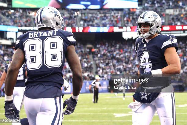 Dak Prescott of the Dallas Cowboys celebrates a touchdown with Dez Bryant in the fourth quarter against the New York Giants during the game at...