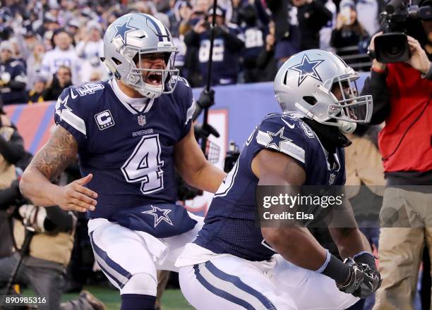 Rod Smith of the Dallas Cowboys celebrates his touchdown with teammate Dak Prescott in the fourth quarter against the New York Giants on December 10,...