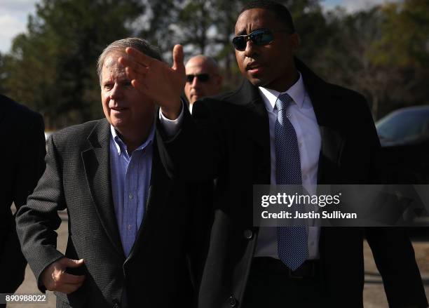 Democratic Senatorial candidate Doug Jones prepares to greet voters outside of a polling station at the Bessemer Civic Center on December 12, 2017 in...