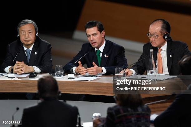 Chinese Vice Premier Ma Kai, Mexican President Enrique Pena Nieto and World Bank President Jim Yong Kim take part in a session of the One Planet...