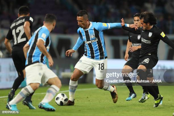 Lucas Barrios of Gremio FBPA holds off Jorge Hernandez of CF Pachuca during the FIFA Club World Cup UAE 2017 semi-final match between Gremio FBPA and...