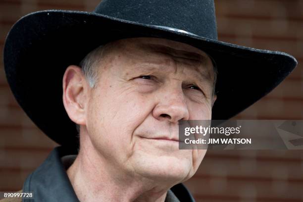 Republican Senatorial candidate Roy Moore speaks to the media after arriving at a polling station in Gallant, Alabama, on December 12, 2017. The...