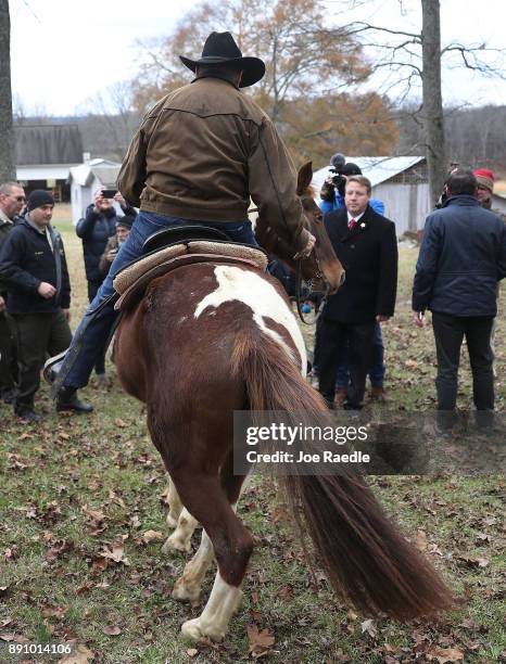 Republican Senatorial candidate Roy Moore rides his horse away after casting his vote at the polling location setup in the Fire Department on...