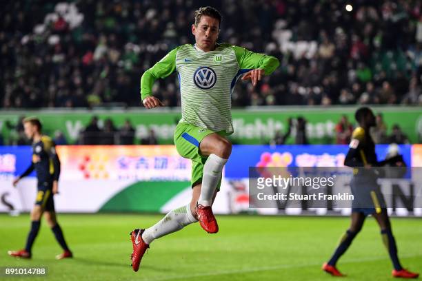 Paul Verhaegh of VfL Wolfsburg celebrates after scoring from the penalty spot to make it 0-1 during the Bundesliga match between VfL Wolfsburg and RB...