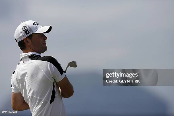 South African golfer Branden Grace watches his drive on the 4th tee, on the final day of the 138th British Open Championship at Turnberry Golf Course...