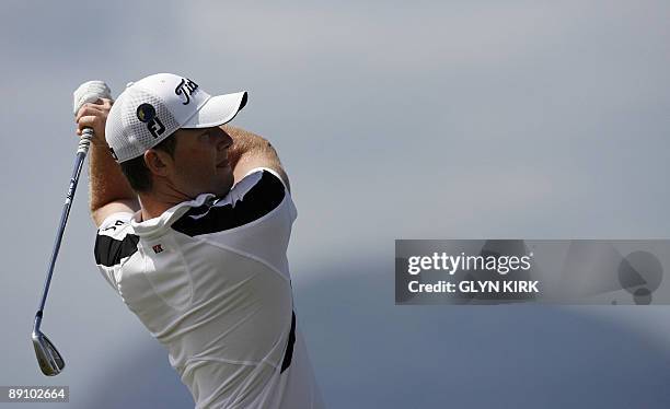 South African golfer Branden Grace watches his drive on the 4th tee, on the final day of the 138th British Open Championship at Turnberry Golf Course...