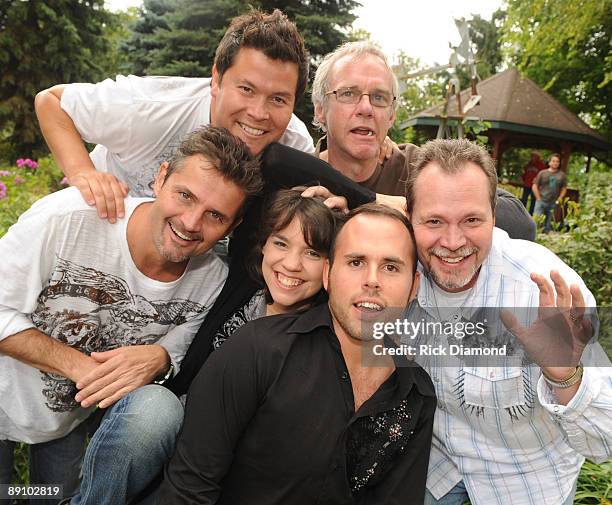 Terry Eldredge, Jamie Johnson, Terry Smith, Kristin Scott Benson, Jeremy Abshire and Danny Roberts of Bluegrass Group The Grascals pose backstage at...