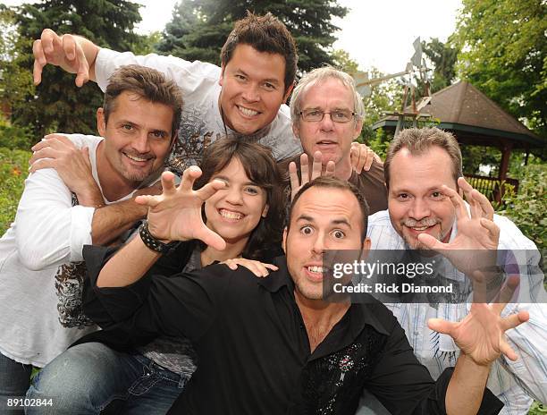 Terry Eldredge, Jamie Johnson, Terry Smith, Kristin Scott Benson, Jeremy Abshire and Danny Roberts of Bluegrass Group The Grascals pose backstage at...