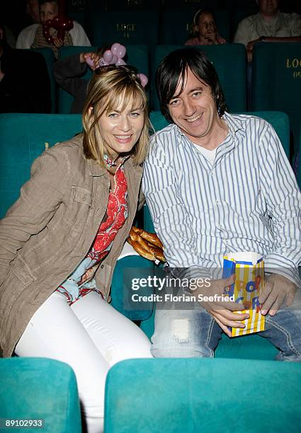 Actress Gesine Cukrowski and Michael Helfrich attend the Berlin premiere of Mullewapp at UCI Kinowelt Colloseum on July 19, 2009 in Berlin, Germany.