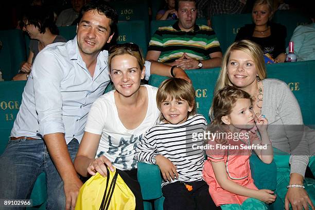 Actor Andreas Elsholz and wife, actress Denise Zich, son Julius and Faye Montana and actress Anne-Sophie Briest attend the Berlin premiere of...