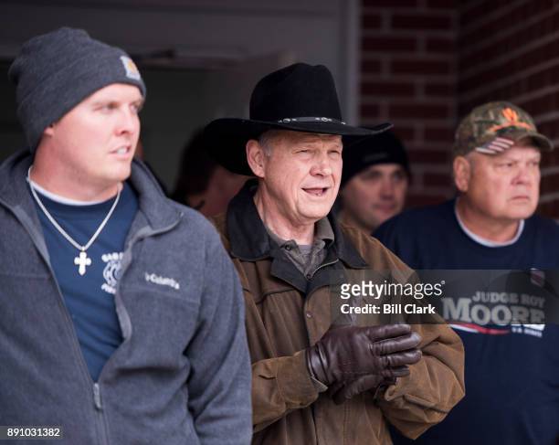 Judge Roy Moore emerges to speak to the media after voting at the Gallant Volunteer Fire Department in Gallant, Ala., on Tuesday, Dec. 12, 2017.