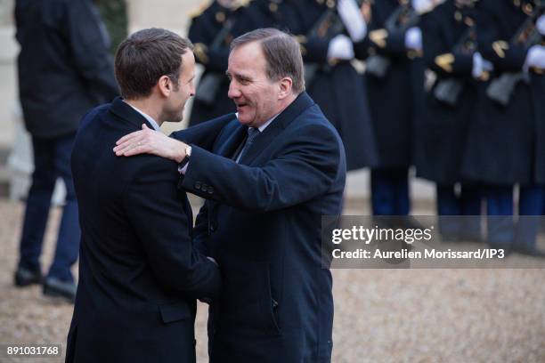 French President Emmanuel Macron greets Sweden's Prime Minister Stefan Lofven as he arrives at the Elysee Palace for a lunch as part of the One...