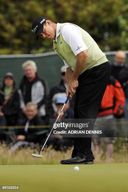 English golfer Lee Westwood putts on the 1st green, on the final day of the 138th British Open Championship at Turnberry Golf Course in south west...