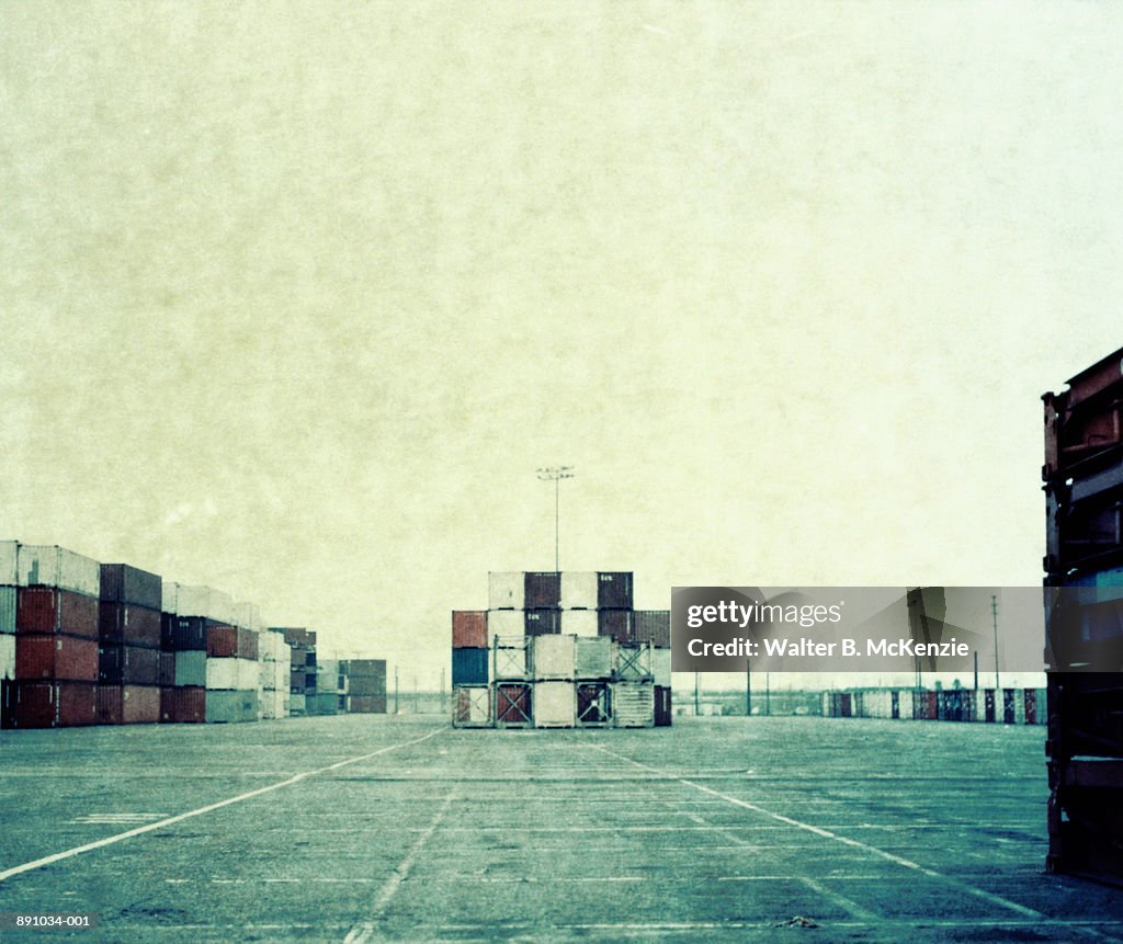 Containers stacked up at shipping dock (paper negative)