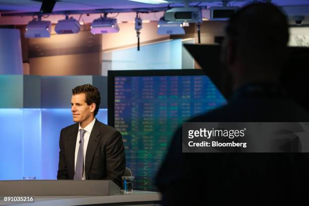 Cameron Winklevoss, president and co-founder of Gemini, listens during a Bloomberg Television interview in New York, U.S., on Tuesday, Dec. 12, 2017....