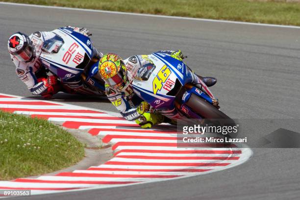 Valentino Rossi of Italy and Fiat Yamaha Team leads Jorge Lorenzo of Spain and Fiat Yamaha Team during the MotoGp race of the German MotoGP on July...
