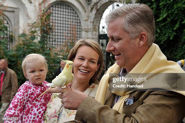 In this handout photo, provided by the Belgian Royal Palace, Princess Eleonore, Princess Mathilde and Prince Philippe of Belgium attend a Summer...