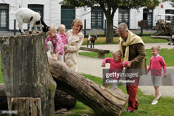 In this handout photo, provided by the Belgian Royal Palace, Prince Emmanuel, Prince Philippe, Princess Eleonore and Princess Mathilde of Belgium...