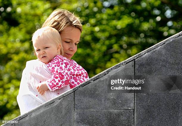 In this handout photo, provided by the Belgian Royal Palace, Princess Eleonore and Princess Mathilde of Belgium attend a Summer Photocall at...