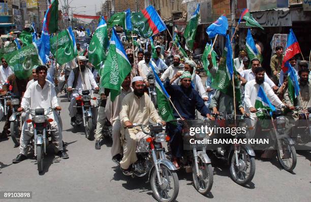 Activists of Pakistani Jamaat-e-Islami party march during ananti-US rally in Quetta on July 19, 2009 against the military operation in tribal areas....