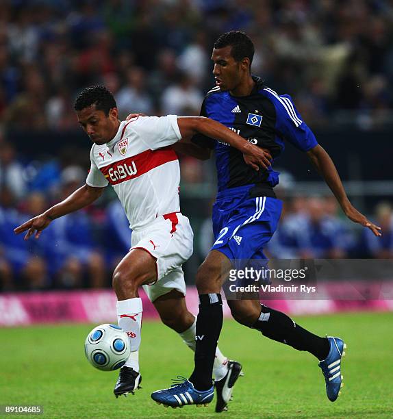 Elson Falcao da Silva of Stuttgart and Eric-Maxim Choupo Moting of Hamburg battle for the ball during the T-Home Cup final match between VfB...