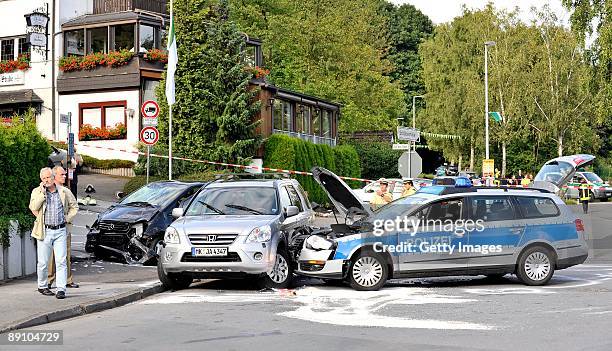 Accident damaged cars mark the scene on July 19, 2009 in Menden near Arnsberg, Germany. A car rammed a parade in the German town of Menden on Sunday,...