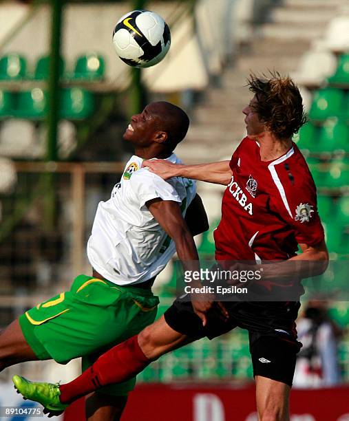 Dmitri Tarasov of FC Moscow battles for the ball with Dramane Traore of FC Kuban Krasnodar during the Russian Football League Championship match...