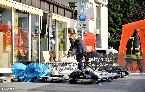 Rescue worker assist in accident clearance on July 19, 2009 in Menden near Arnsberg, Germany. A car rammed a parade in the German town of Menden on...